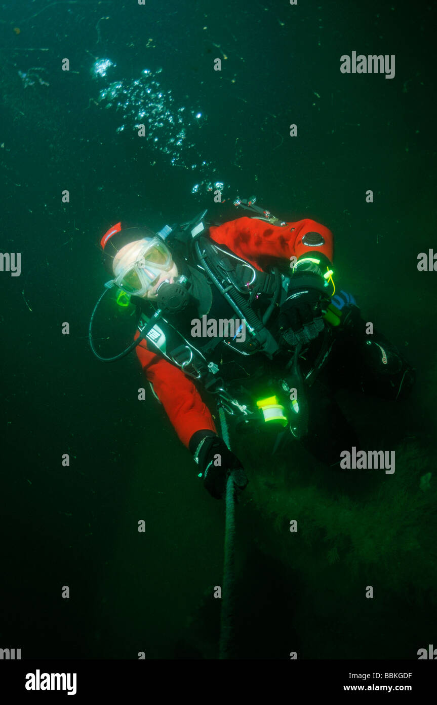 Scuba diver on underwater wreck of ship the HMS Scylla Plymouth Devon UK Stock Photo
