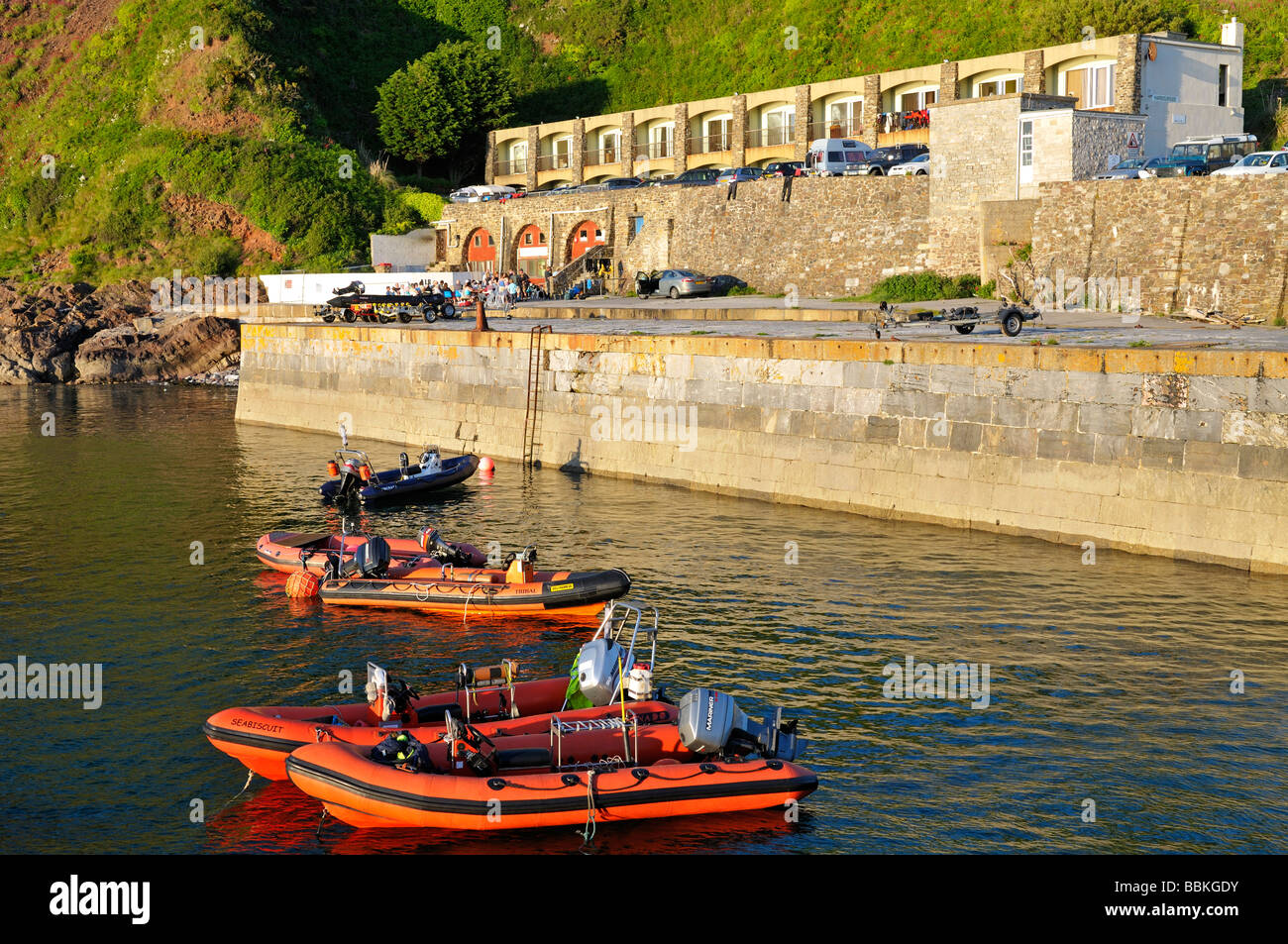 Orange RIBs boats in Fort Bovisand harbour Plymouth Devon UK Stock Photo