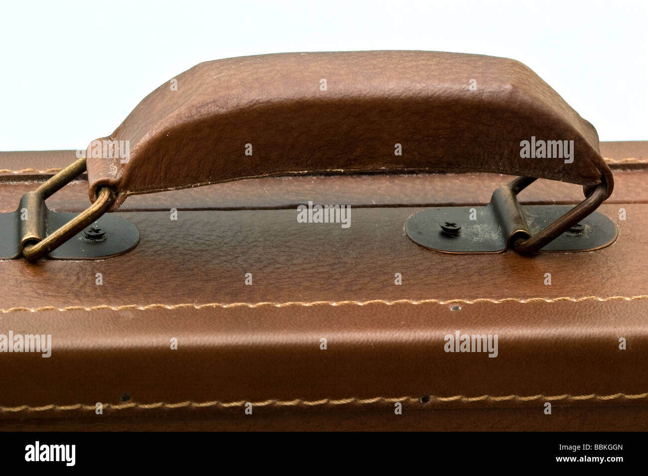 Handle on a brown leather briefcase Stock Photo Alamy