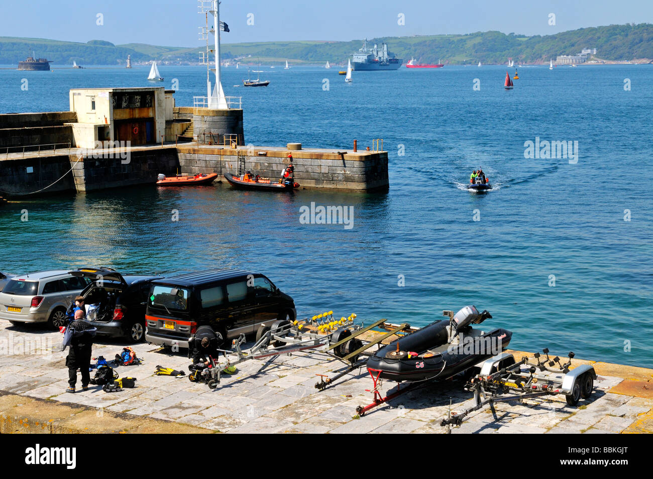 Fort Bovisand harbour and quayside with scuba divers looking out on Plymouth sound UK Stock Photo