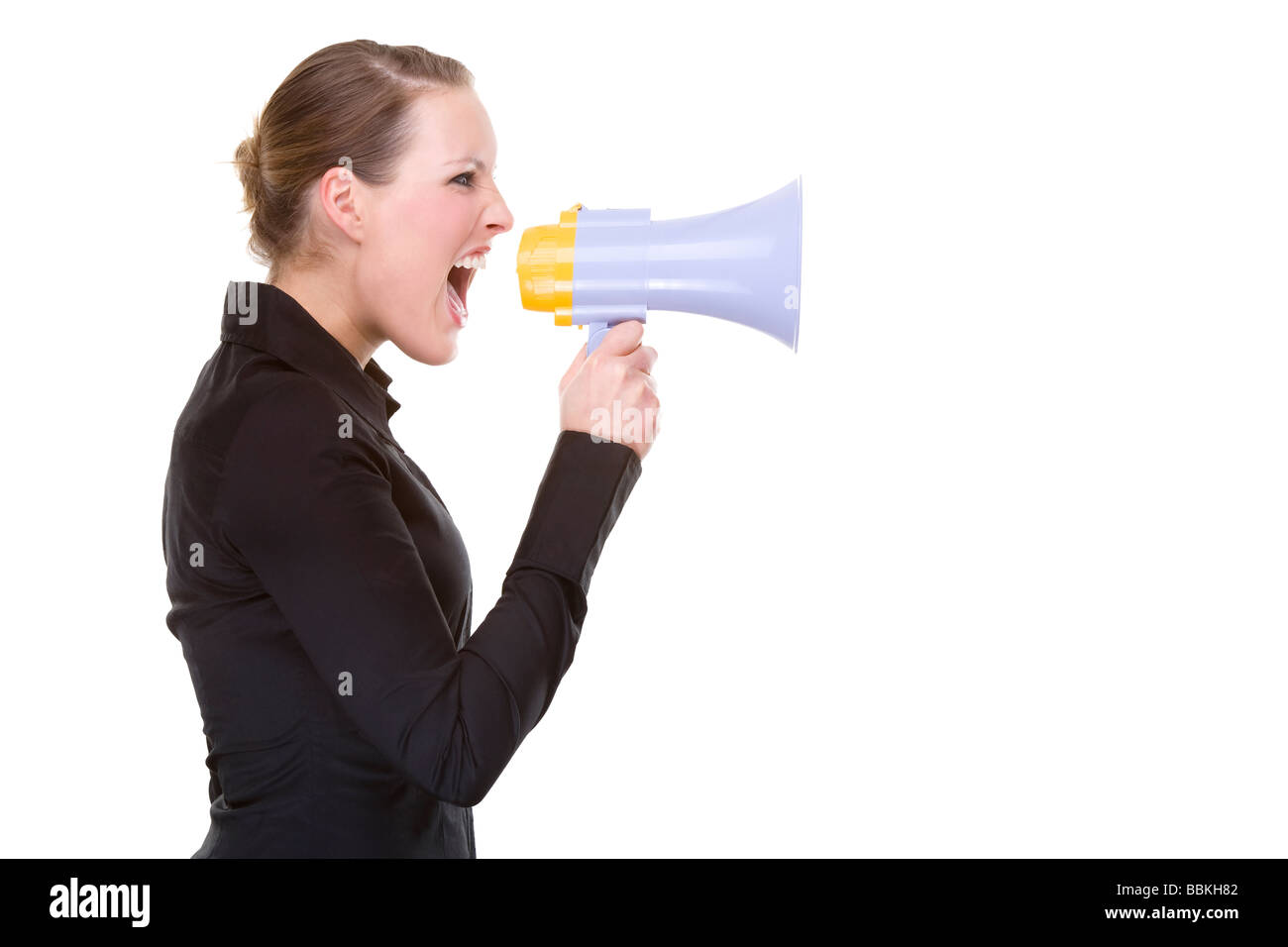 Full isolated portrait of a beautiful caucasian businesswoman shouting with a megaphone Stock Photo