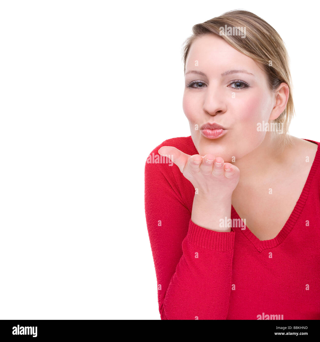 Full isolated portrait of a beautiful caucasian woman blowing a kiss