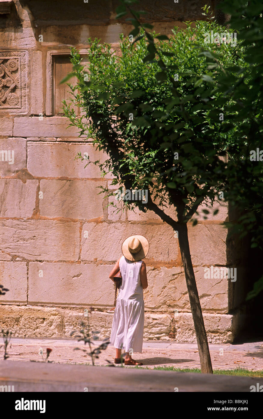Female tourist looking at ancient ruins, Athens, Greece Stock Photo