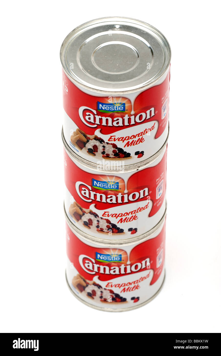 Three stacked tins of Carnation Evaporated Milk Stock Photo