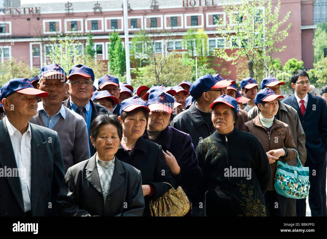A Chinese tour group gathers outside the Presidential palace in Nanjing China Stock Photo