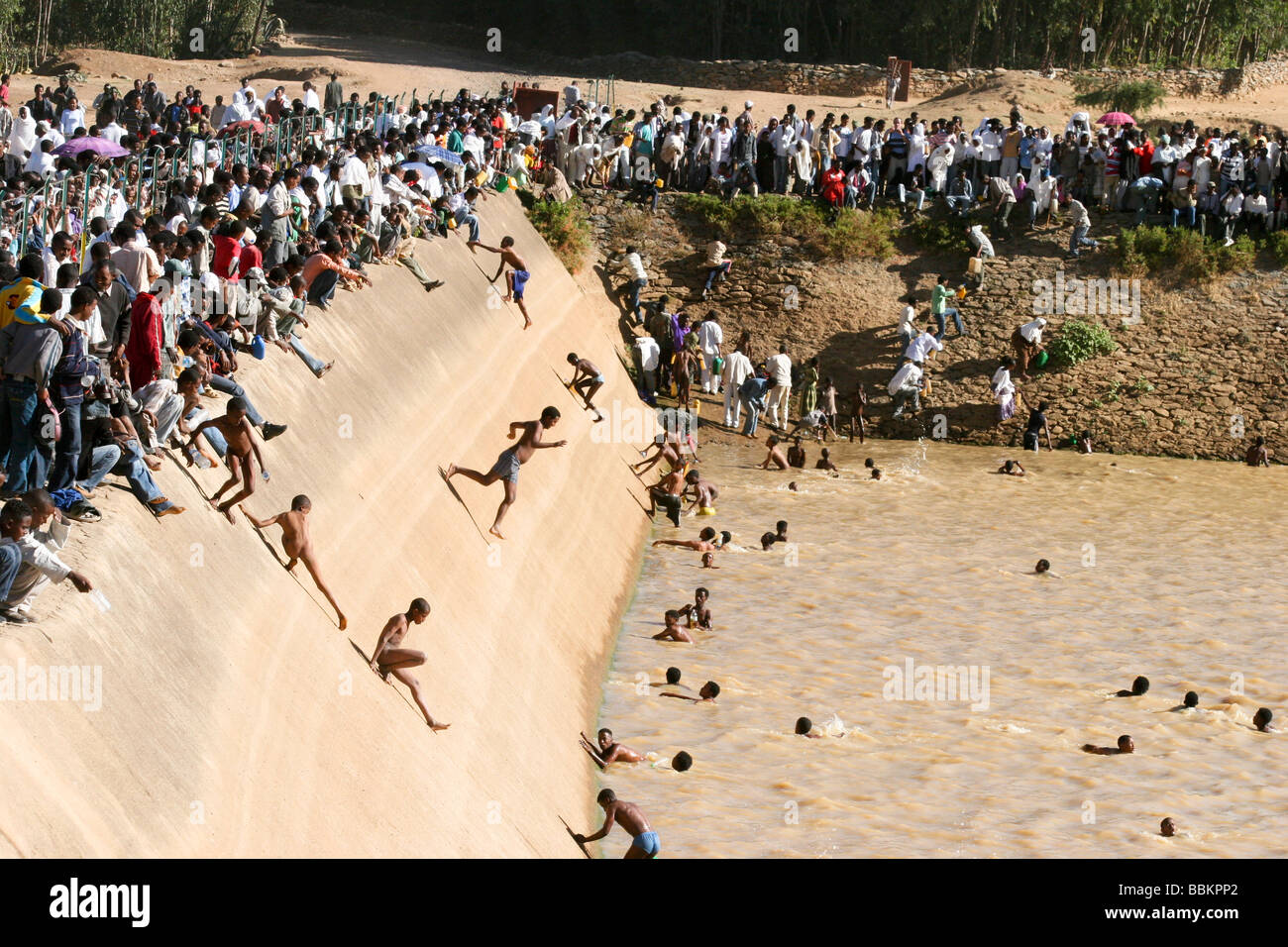 Africa Ethiopia Axum Timket ceremony youth jump into a pool of holy water as a part of a coming of age ceremony Stock Photo
