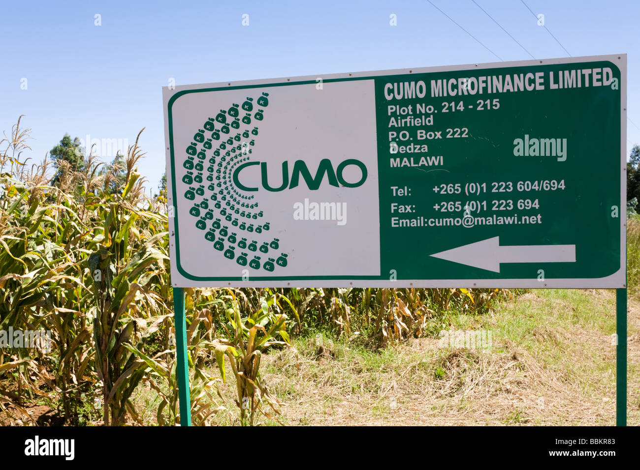A sign for Cumo Microfinance Limited at Dedza, Malawi, Africa Stock Photo