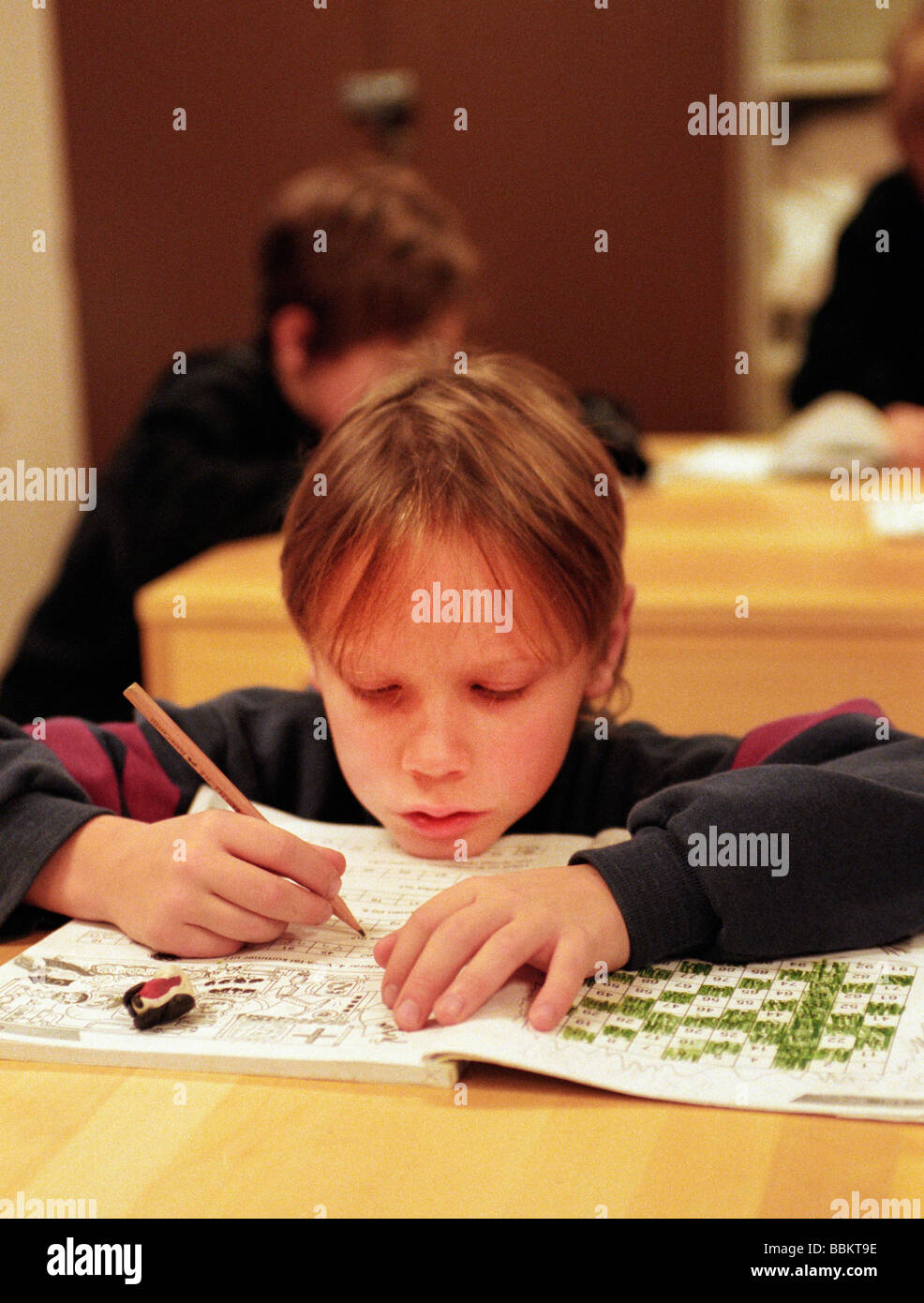 8-year-old-boy-in-class-at-school-stock-photo-alamy