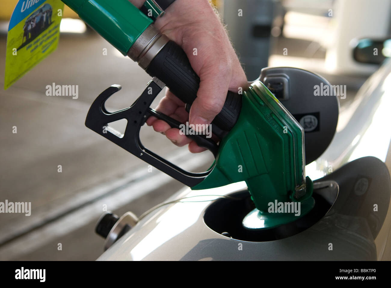 Motorist filling his car with unleaded fuel, BP petrol station, Toddington Services, Bedfordshire, UK. Stock Photo