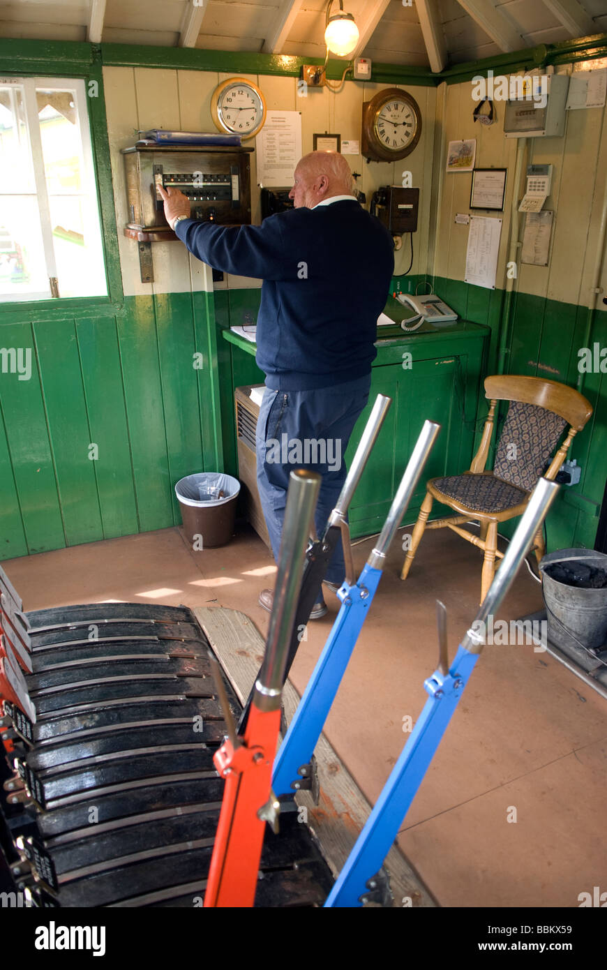 Ted, the Signalman, in Signal Box, Watercress Line, Alresford, Hampshire UK Stock Photo