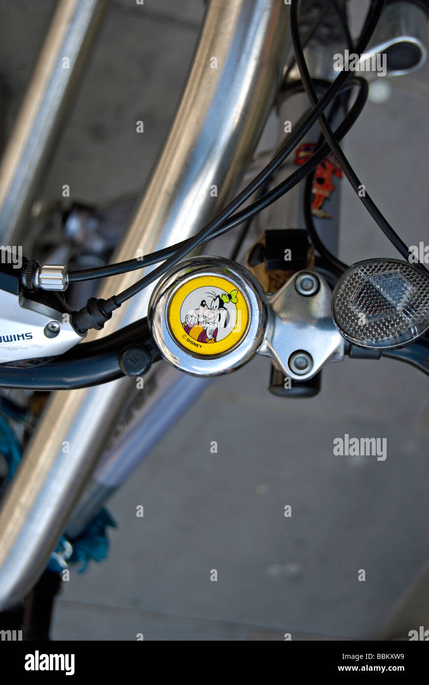 image of the disney character goofy on a bike bell,  in hammersmith, west london, england Stock Photo