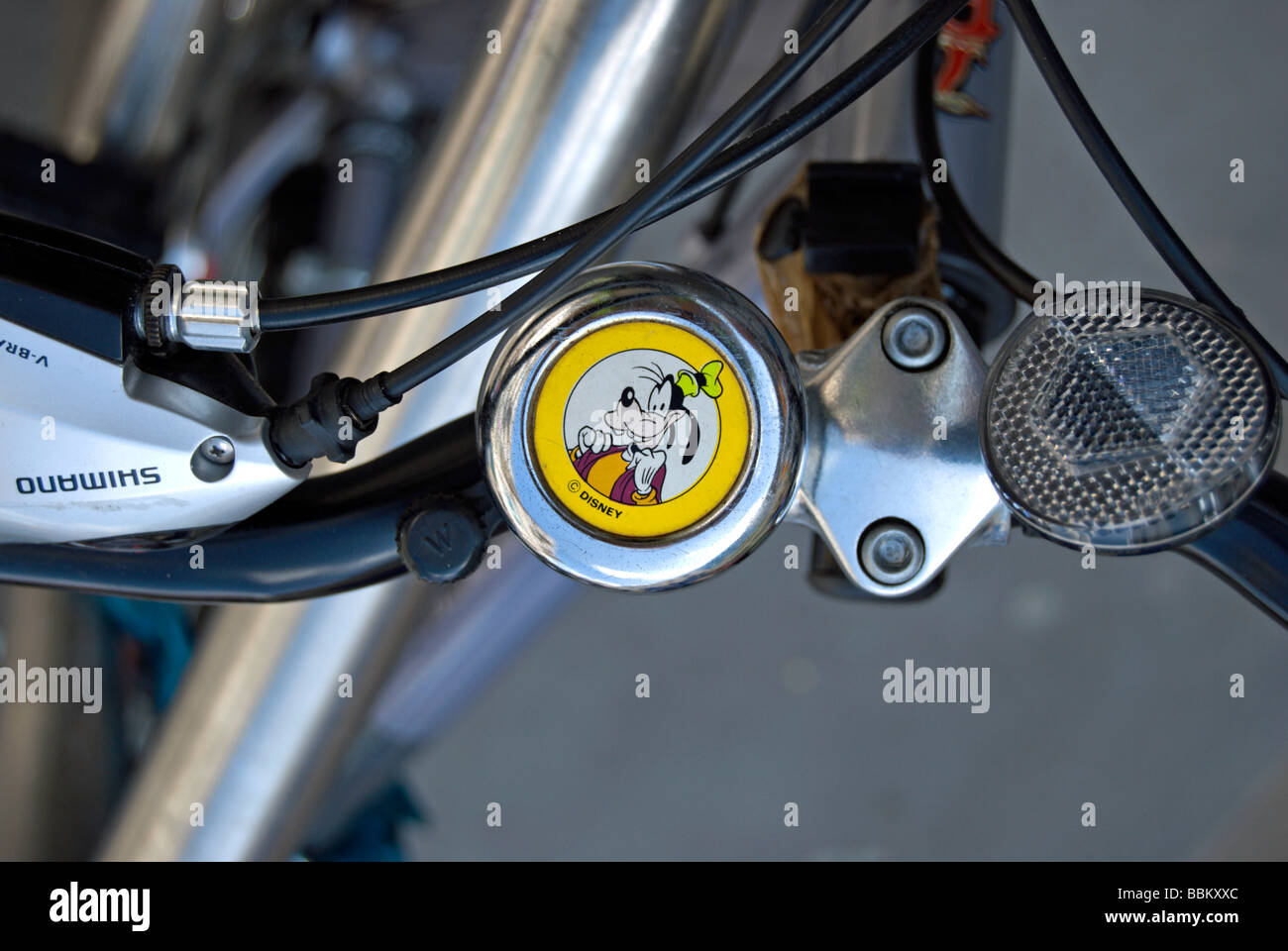 image of the disney character goofy on a bike bell,  in hammersmith, west london, england Stock Photo