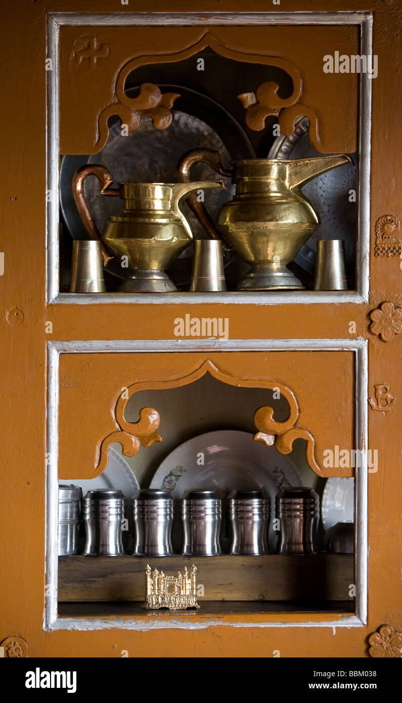 Ladakh, India; Kitchen cupboards containing traditional jugs and glasses Stock Photo