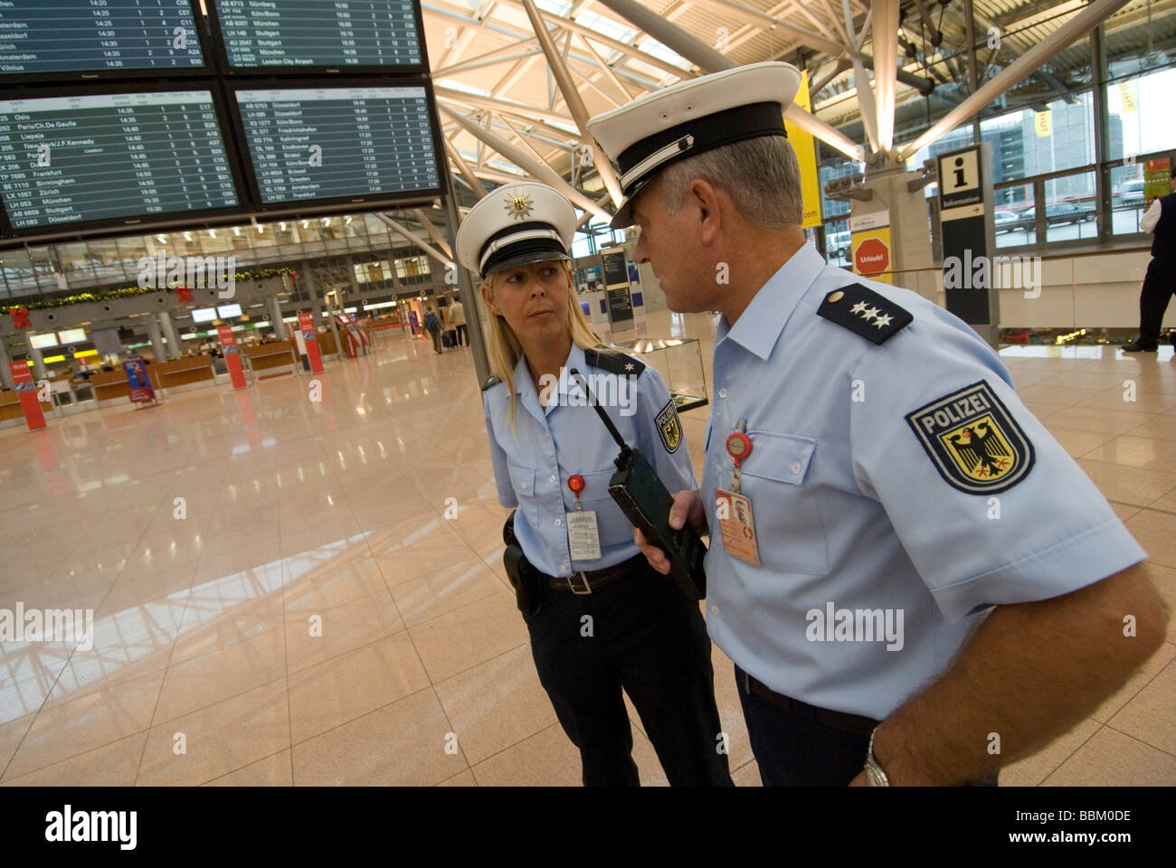 Security officers, man, woman, Hamburg Airport, Hamburg, Germany Stock Photo Alamy
