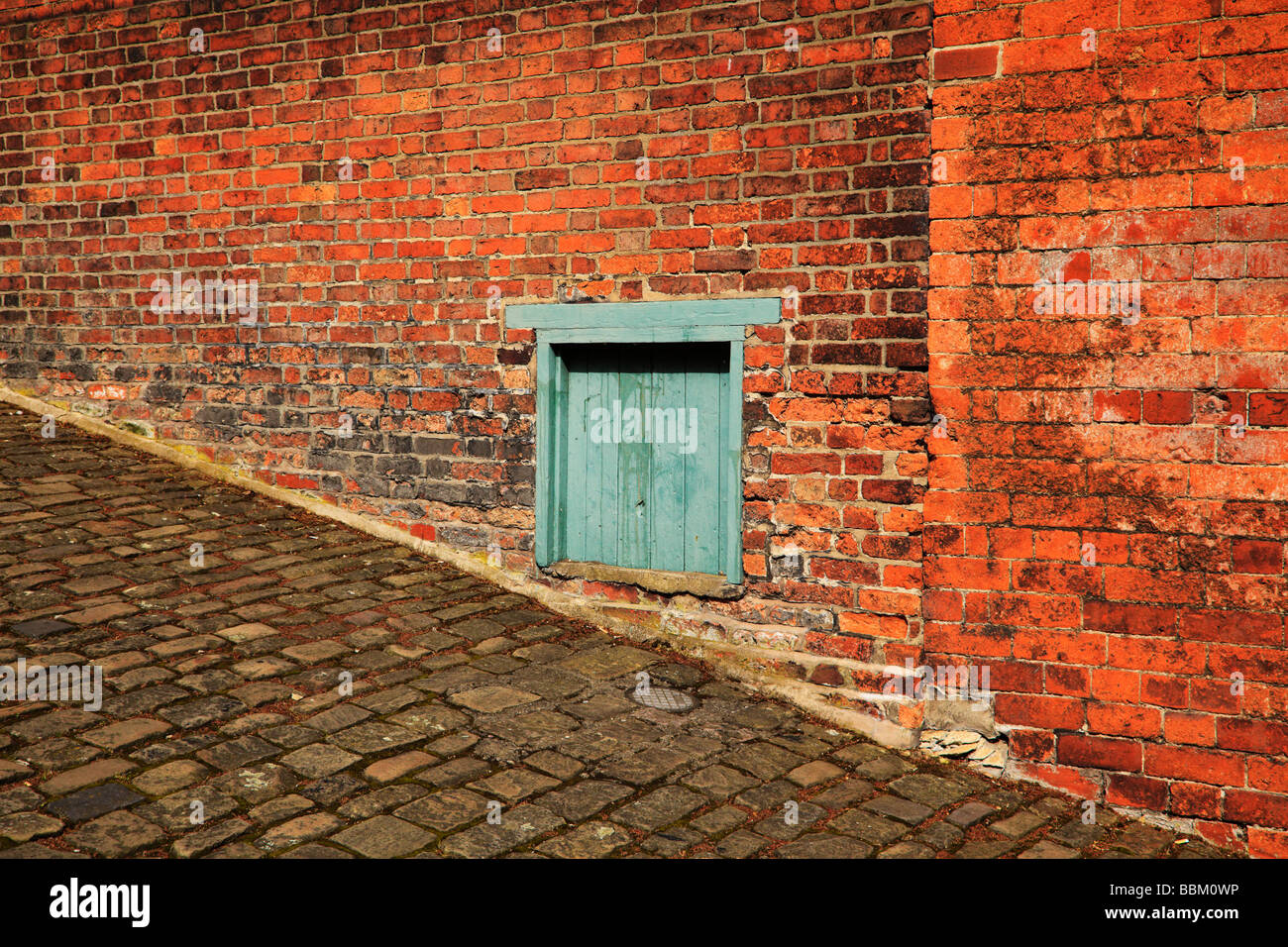 Textures and angles, Red brick, cobbles, wood. Steep Hill, Lincoln, Lincolnshire, England Stock Photo