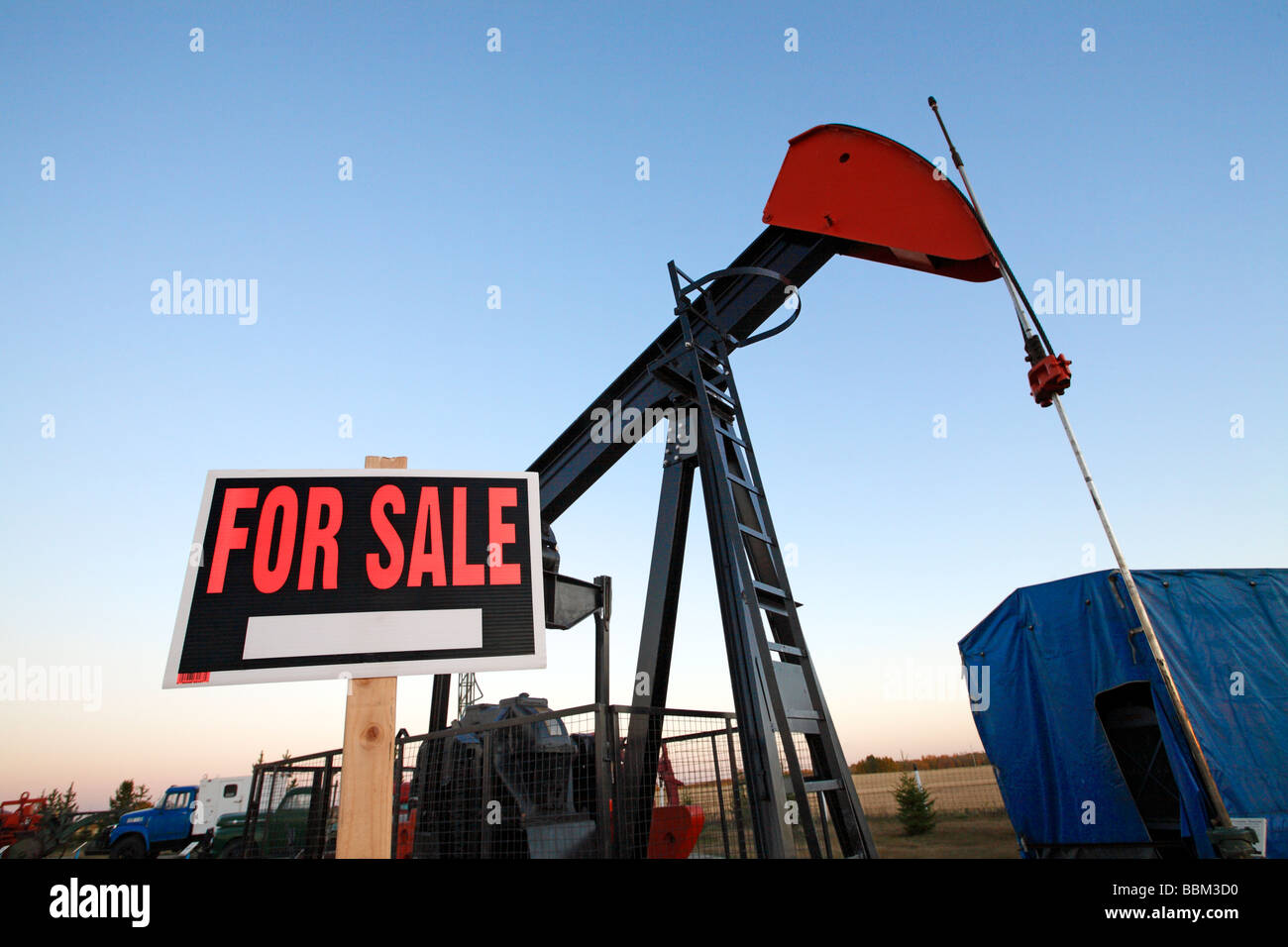 Oil pumpjack with for sale sign Stock Photo Alamy