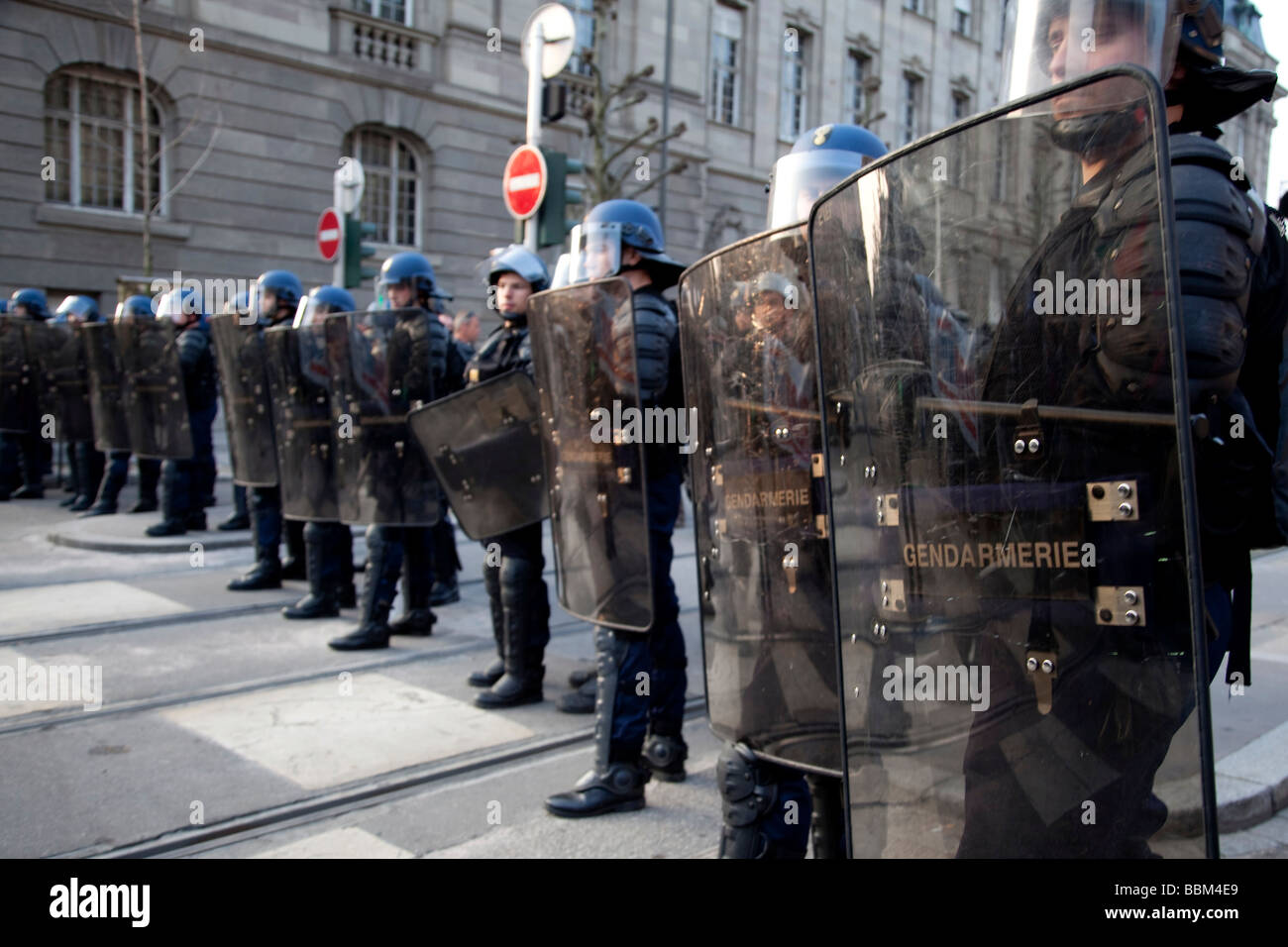 Row of police officers blocking the street during protests against the NATO-summit, Strasbourg, France Stock Photo