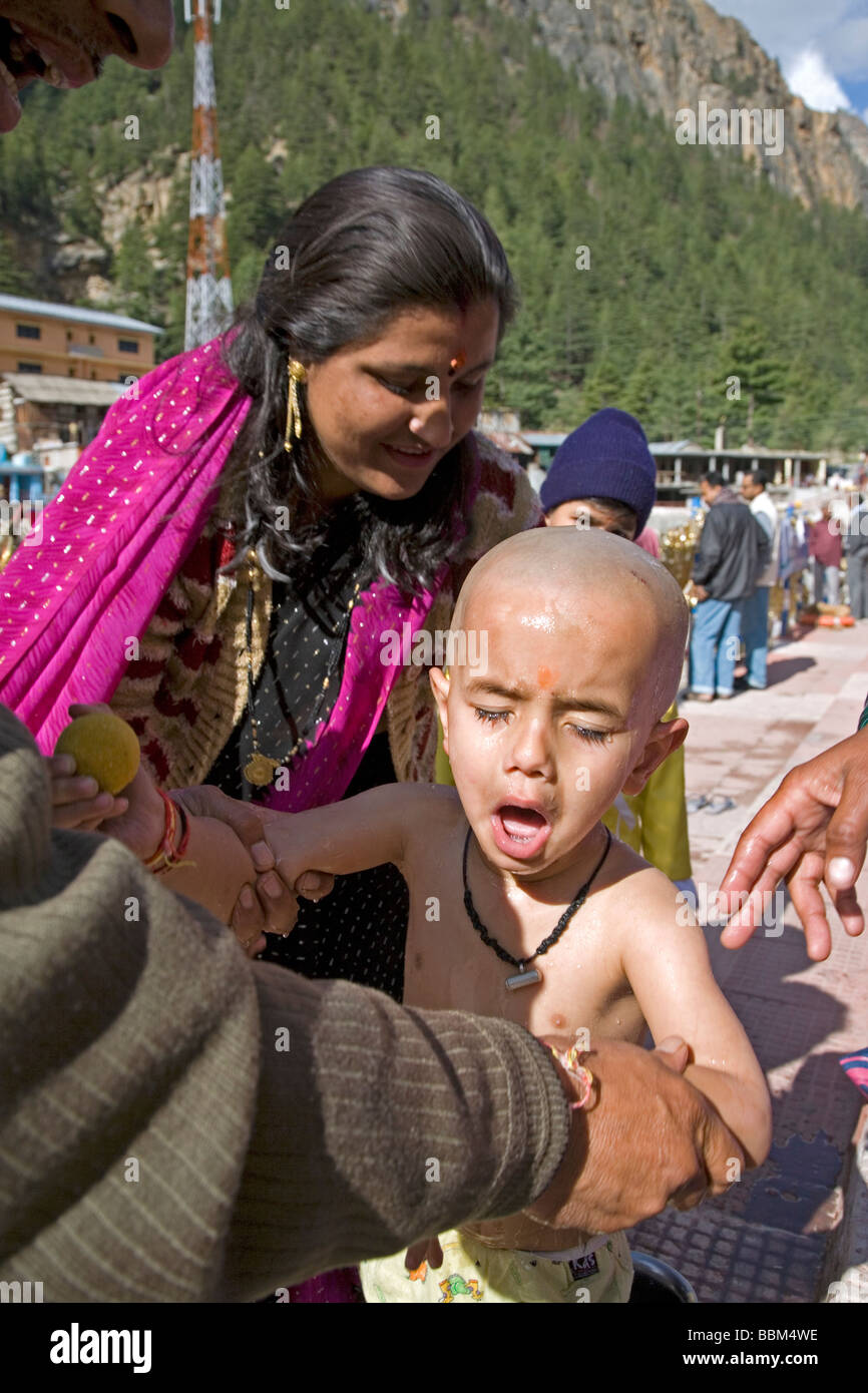 Indian mother woman washing son hi-res stock photography and images - Alamy