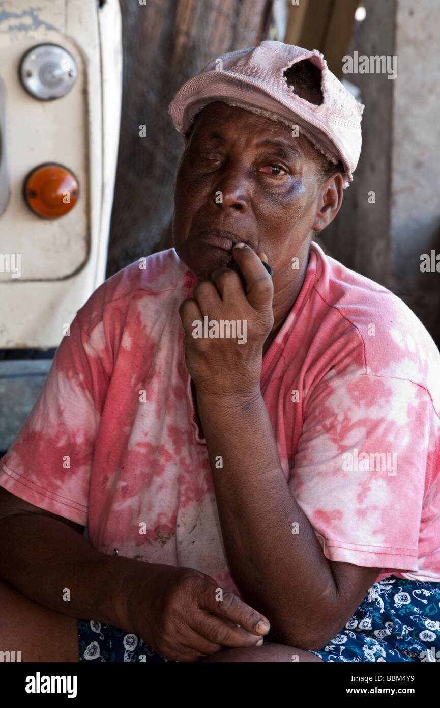 An old local Caribbean woman smoking a pipe at Douglas Plantation in Grenada Stock Photo