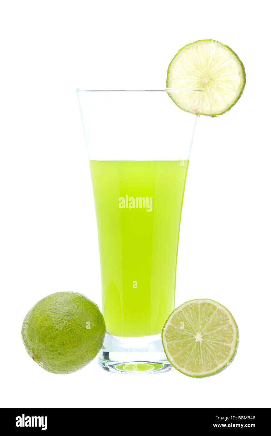 A glass of fresh lime juice with a slice on white background Stock Photo