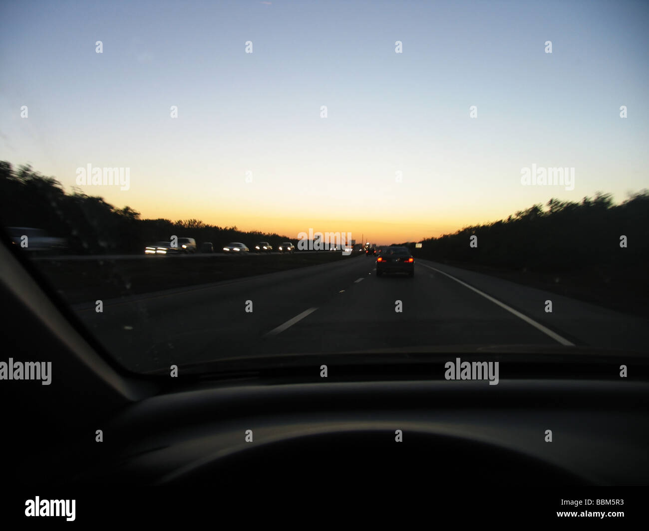 Speeding traffic ,Driving on Expressway at dusk, Florida. Stock Photo