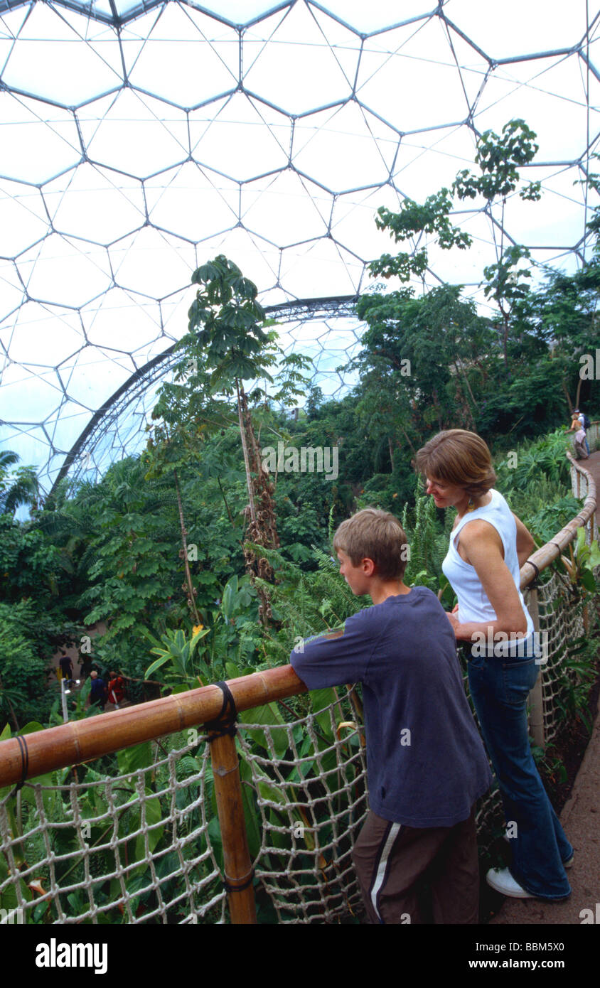 Woman and boy looking out over the Tropical Biome Eden Project Cornwall England Britain UK Stock Photo