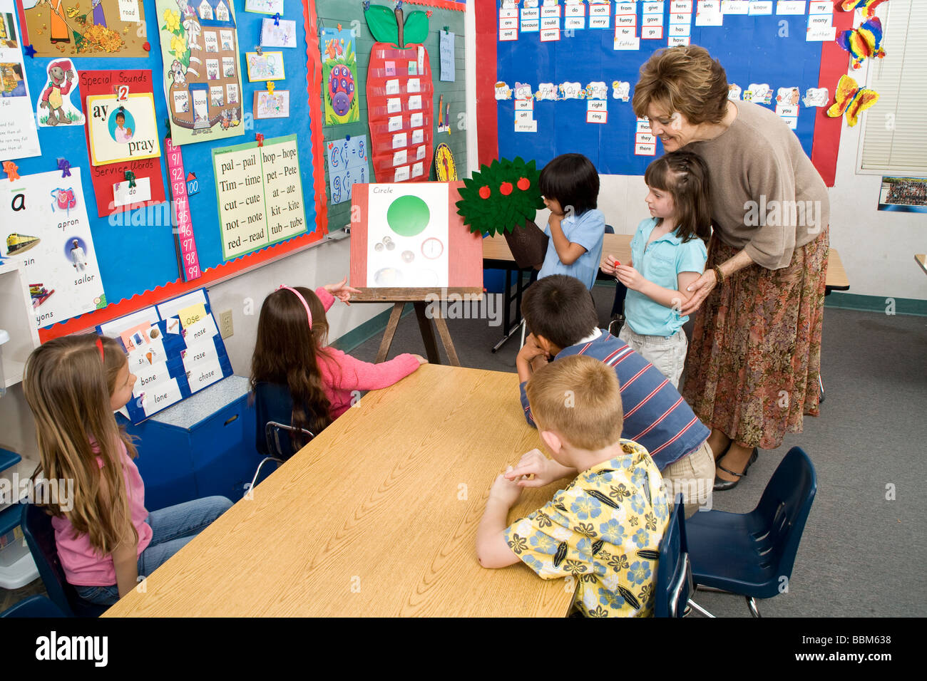 Teacher multi racial diversity racially diverse multicultural cultural  mixed racially mix kindergarten interracial inter racial POV United States Stock Photo