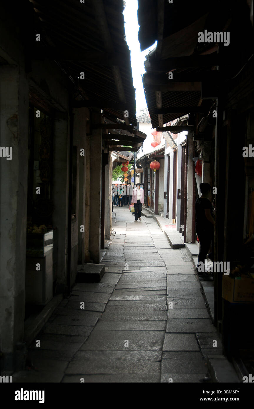 Narrow dark alley of the ancient water town Zhouzhuang Jiangsu China Stock Photo