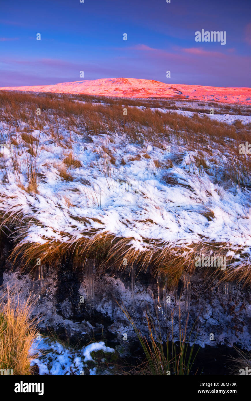 Bathed in pink light the hill name Lovely Seat  is apt. Seen on the road between Swaledale and Hawes. UK GB Europe Stock Photo