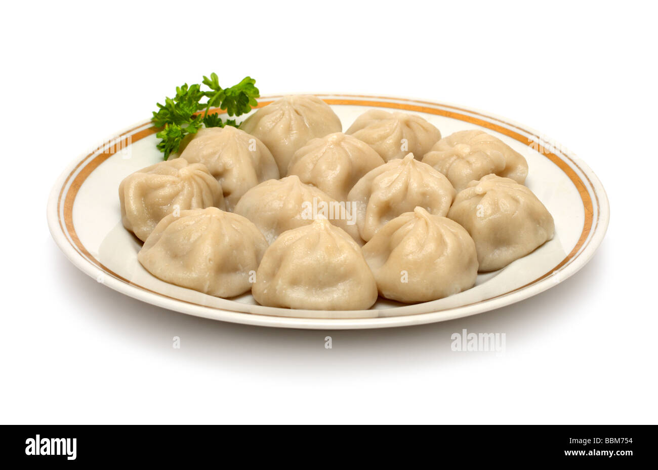 russian ravioli pelmeni on plate isolated on white Stock Photo - Alamy