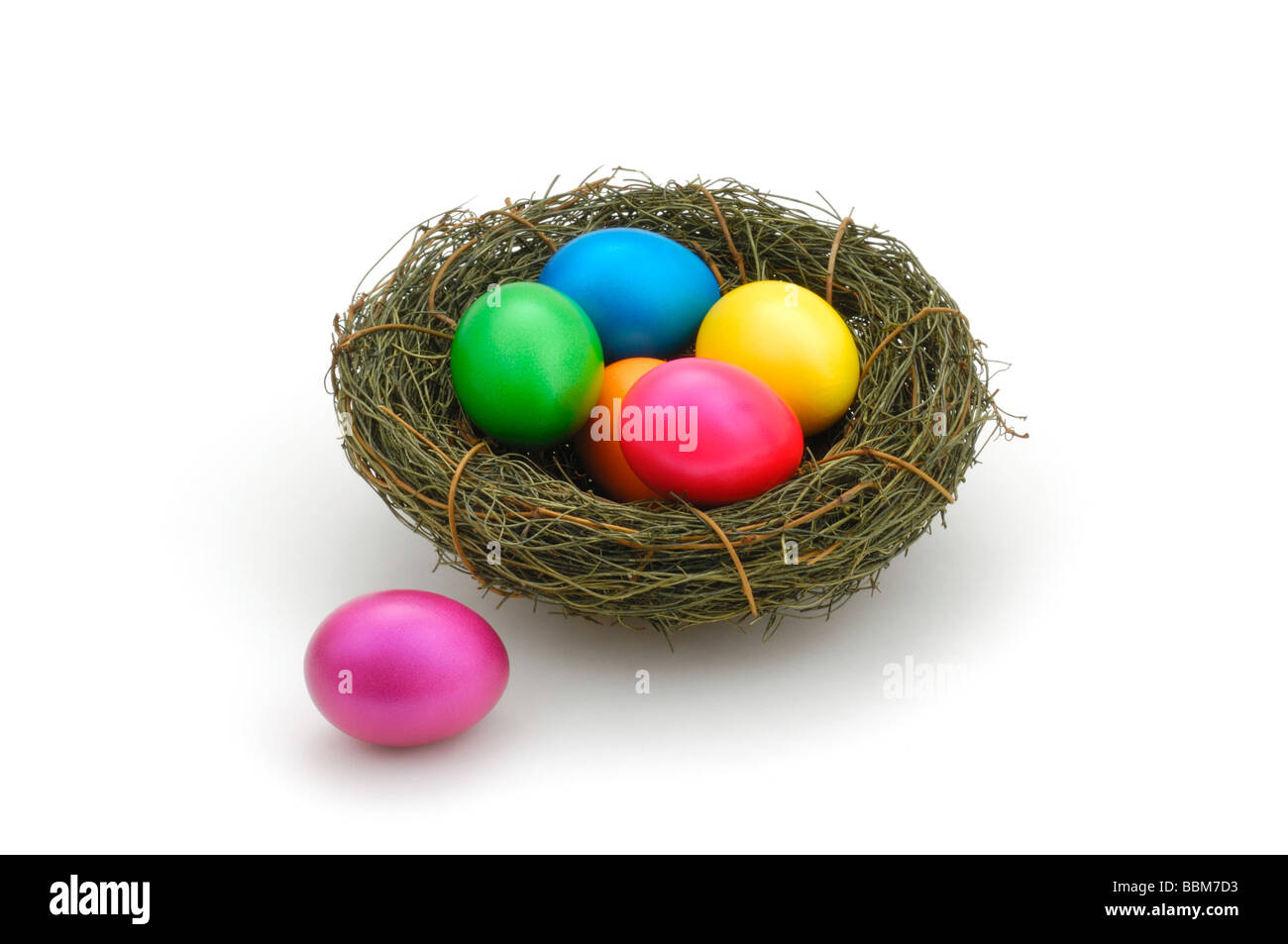 Colorful Easter eggs in Easter basket Stock Photo