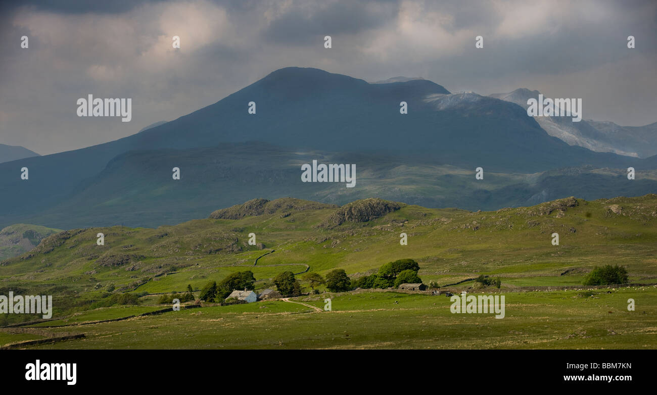 Landscape view of fells and Scafell Pike with storm clouds above, Lake ...