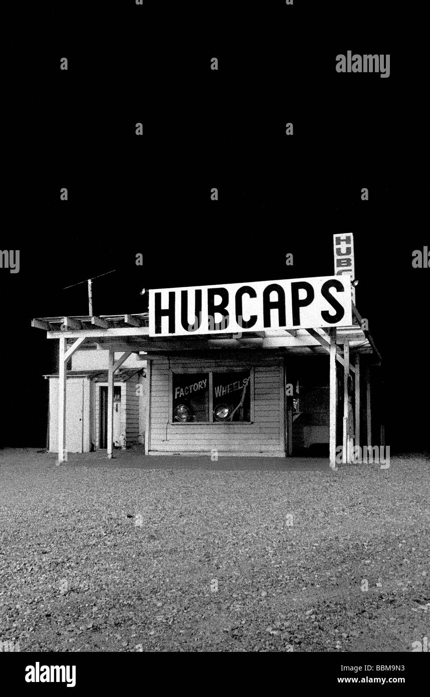 A hubcap store at night Mojave Desert US Stock Photo