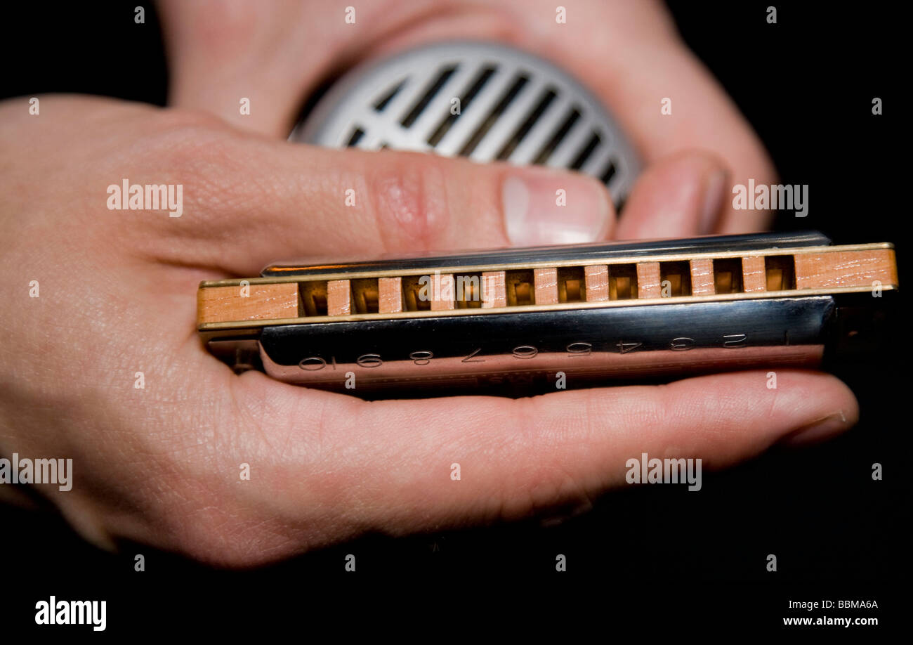 Holding a harmonica deals