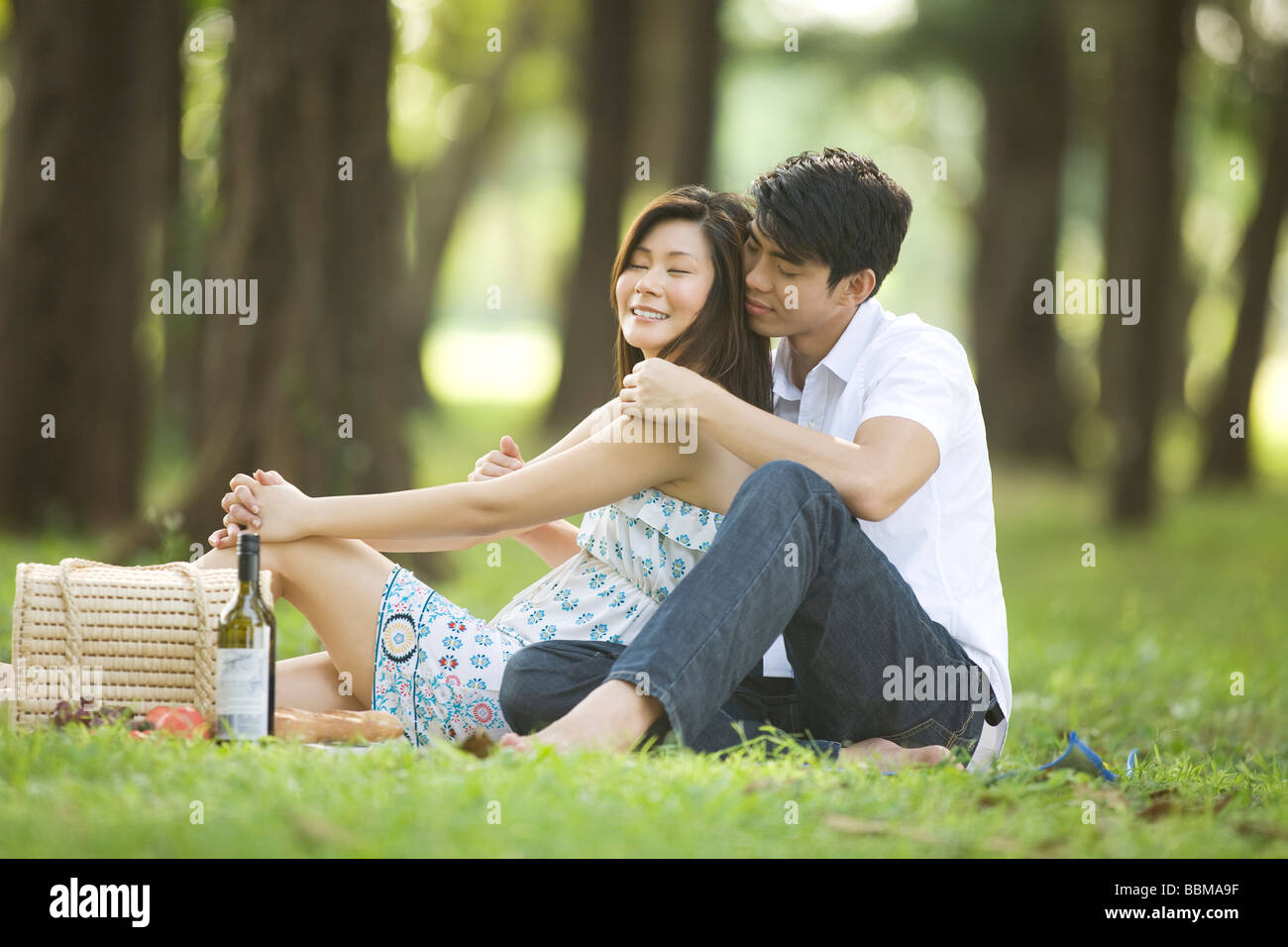 Young couple having picnic in the park Stock Photo