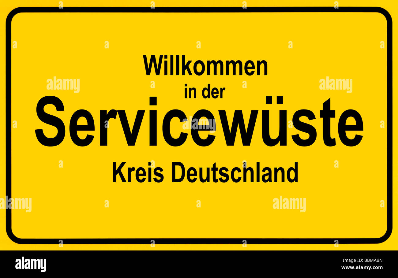 Town sign, German lettering Willkommen in der Servicewueste, symbolic of lack of service in Germany Stock Photo