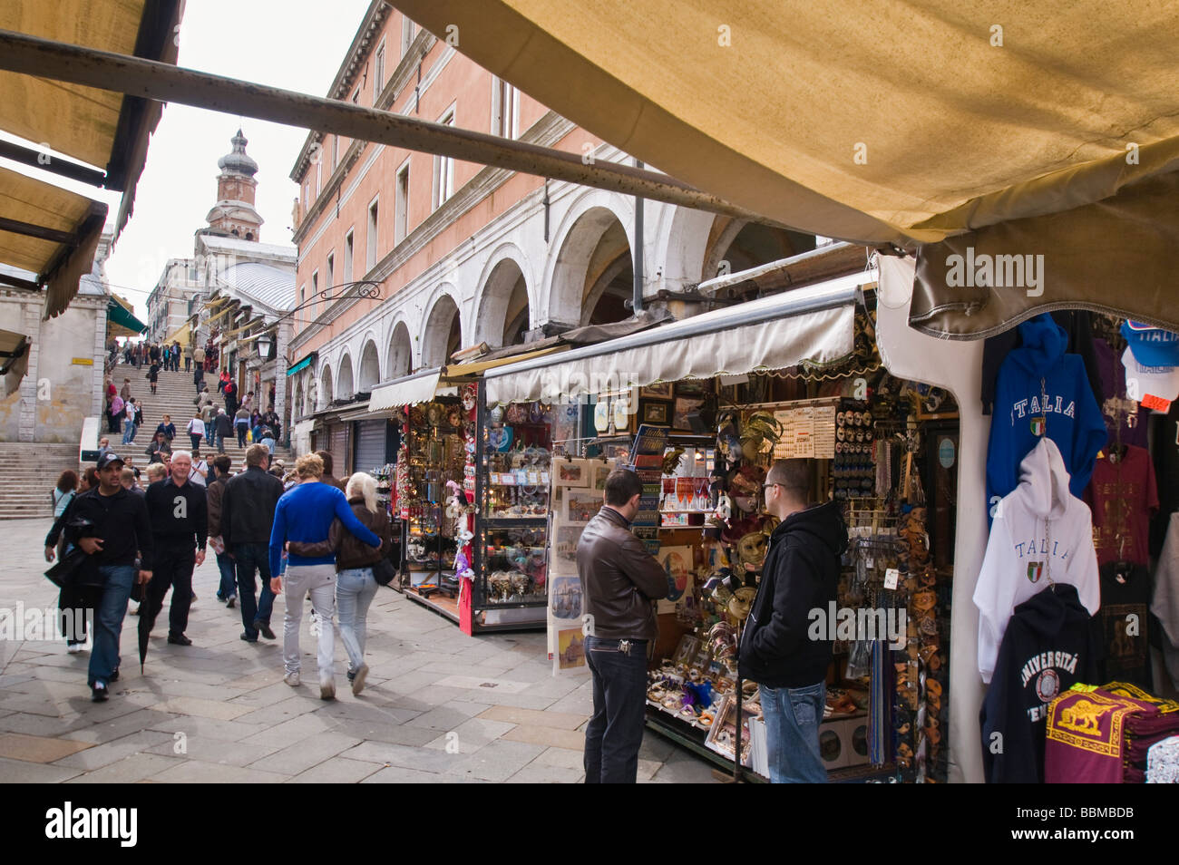 Souvenier stalls lining the street leading to Rialto Bridge San Polo Venice Italy Stock Photo