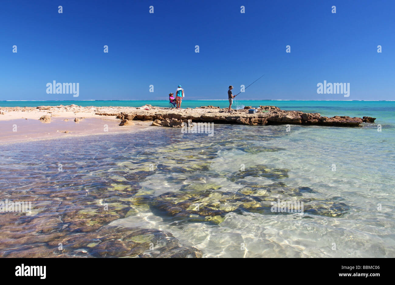 Australian family fishing on a beautiful beach. Ningaloo Reef. Cape Range National Park. Exmouth