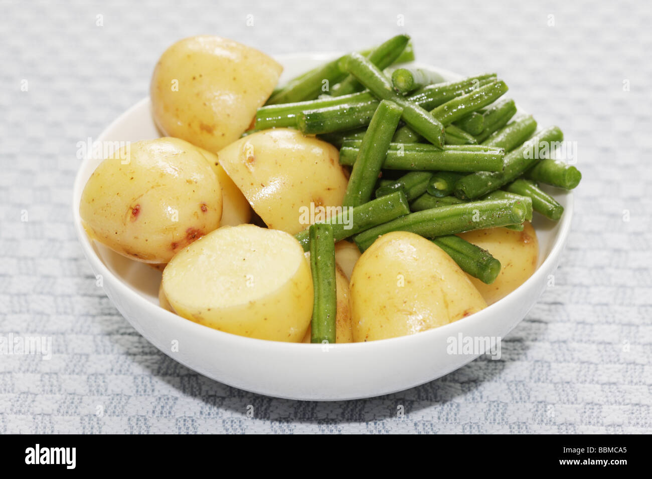 Bowl of Boiled Potatoes and Green Beans Stock Photo