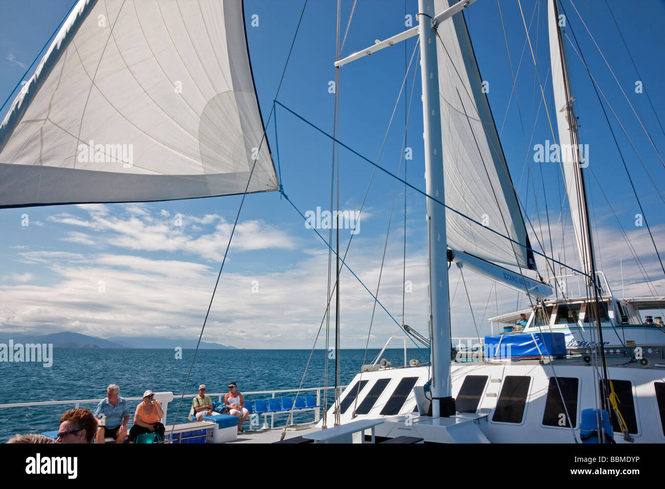 Australia, Queensland. Wavedancer - a luxury sailing catamaran - takes tourists on day trips to Low Isles Stock Photo