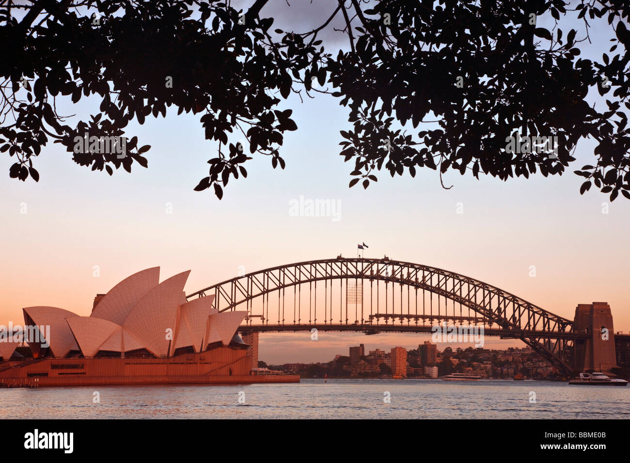 Australia New South Wales. Sydney Opera House and Harbour Bridge at sunrise. Stock Photo