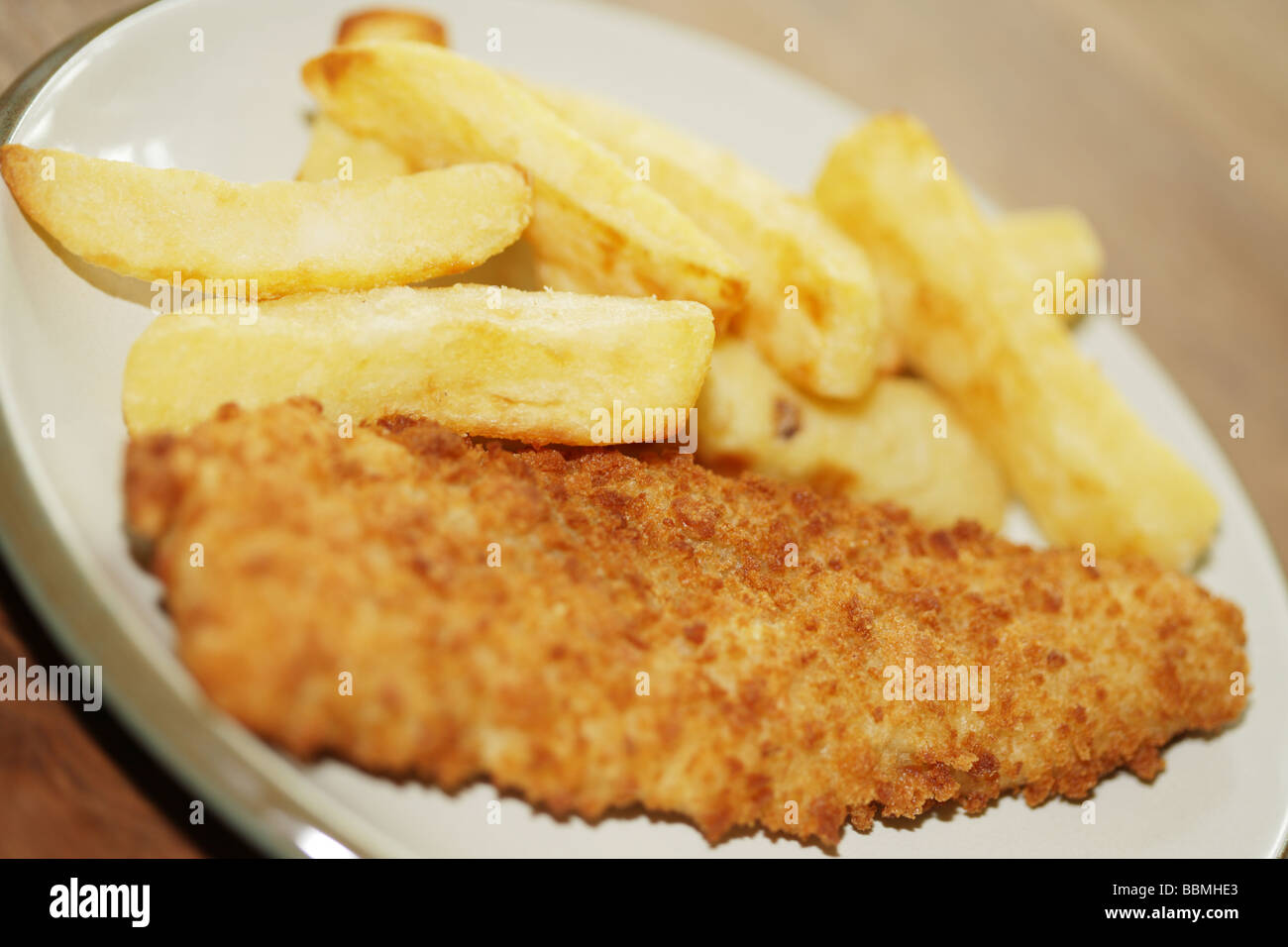 Breaded Haddock with Chips Stock Photo Alamy
