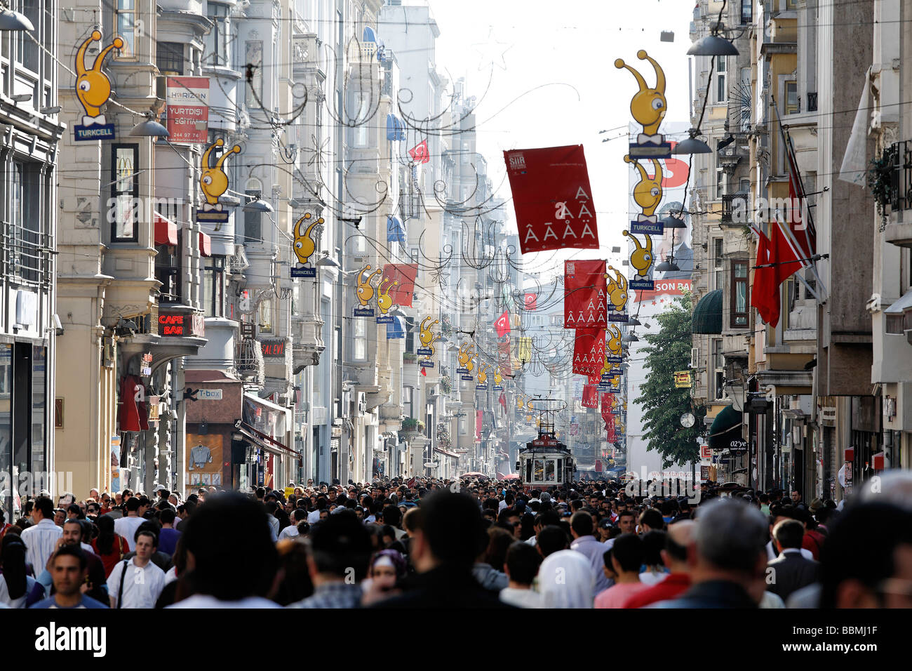 Historic tram driving through the crowd, shopping street Istiklal Caddesi, Independence Street, Beyoglu, Istanbul, Turkey Stock Photo