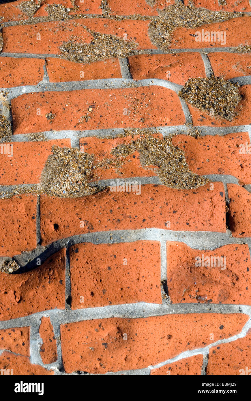 brickwork pattern; bricks worn down by the sea; Stock Photo