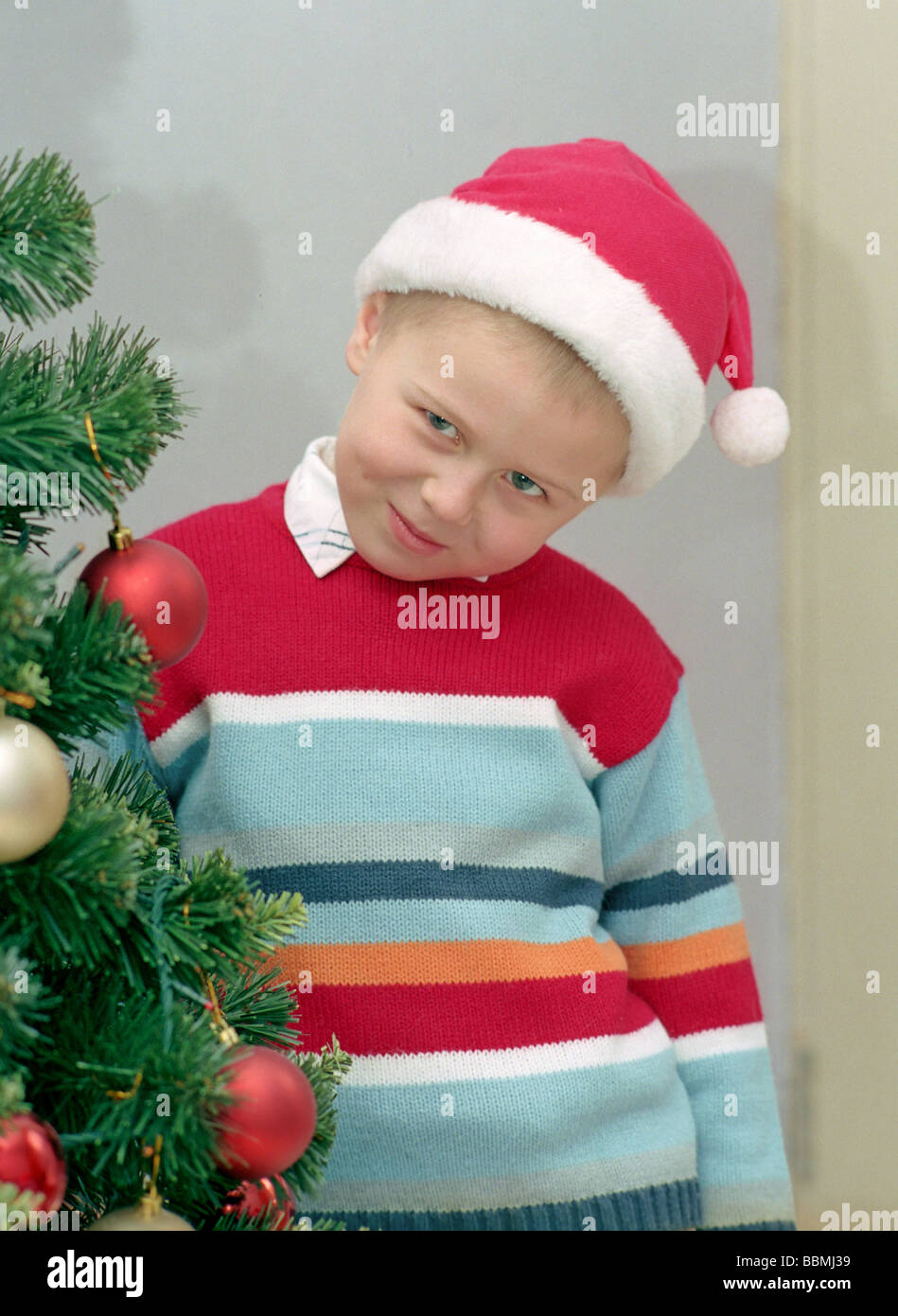 child and christmas tree Stock Photo