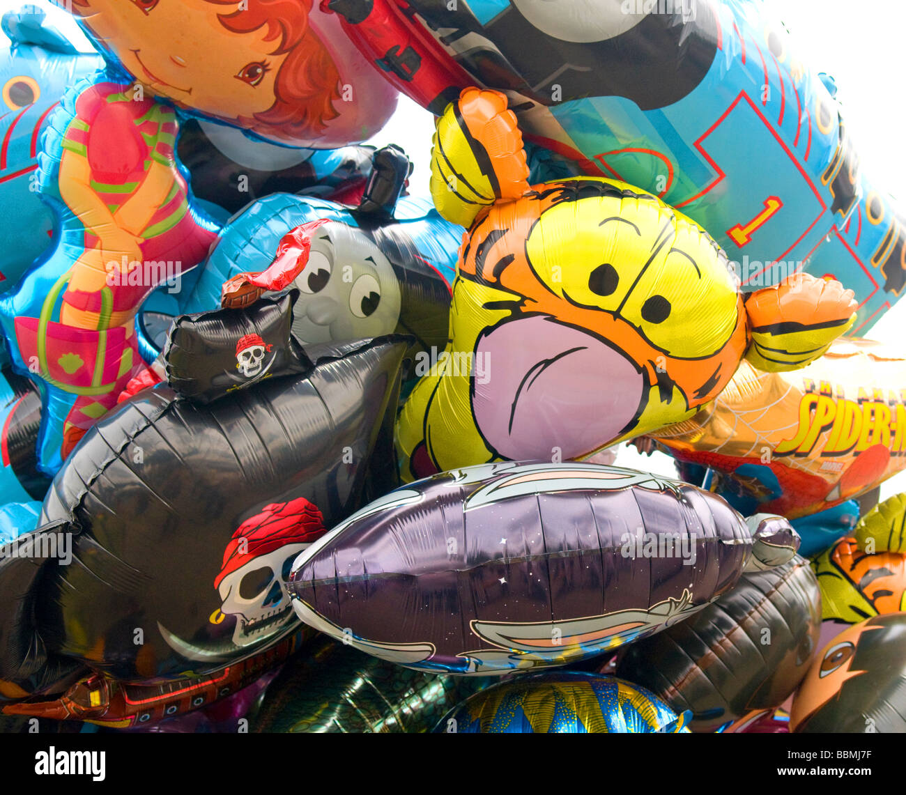 Helium cartoon character balloons on sale at Cambridge Strawberry Fair. Stock Photo