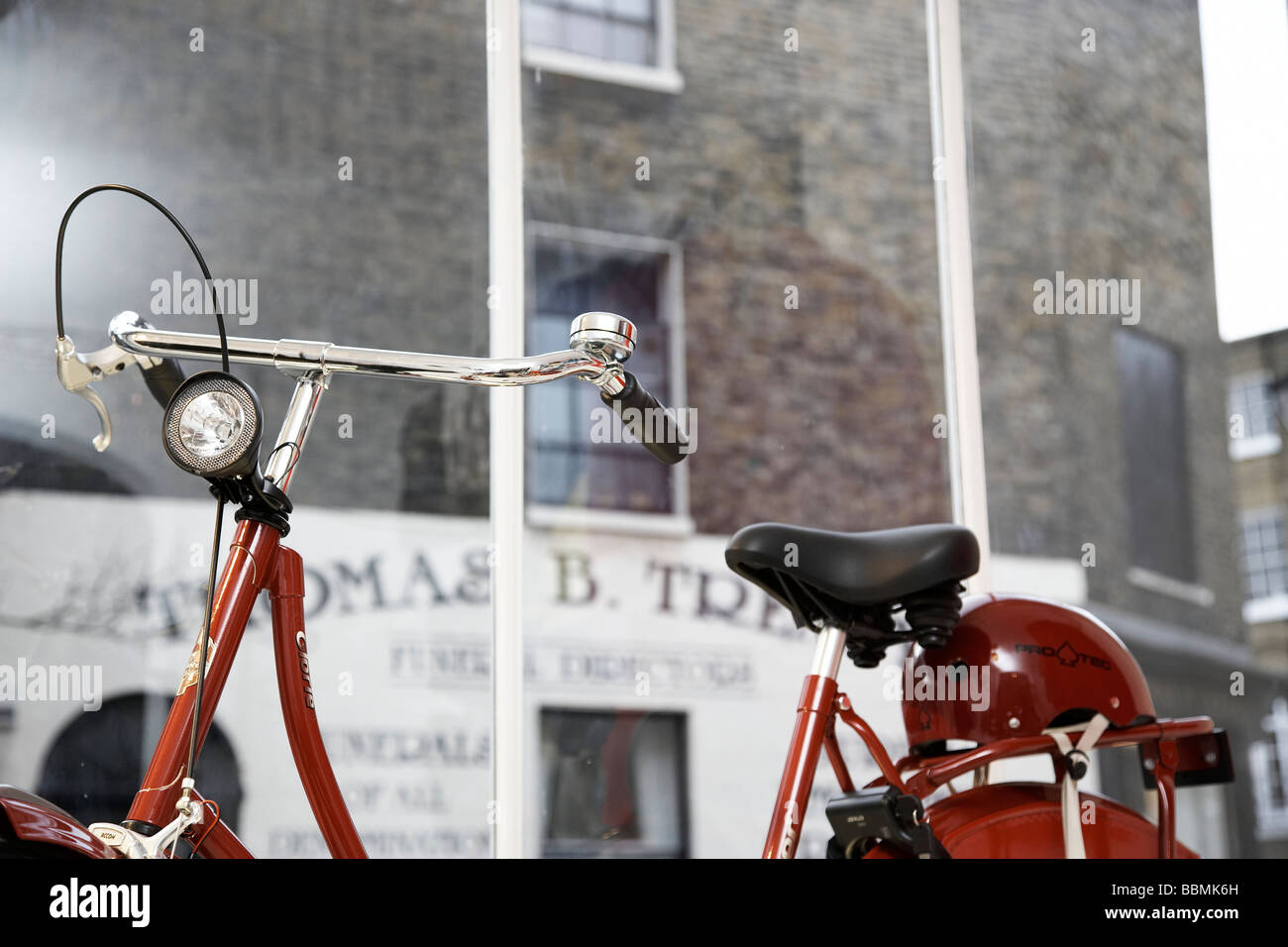 Red vintage bike in the street Stock Photo Alamy