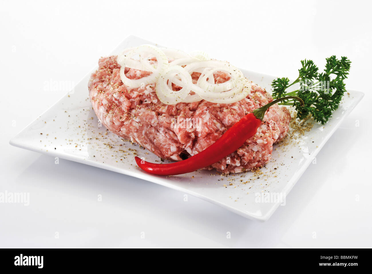 Ground pork, raw minced pork, onion rings Stock Photo Alamy