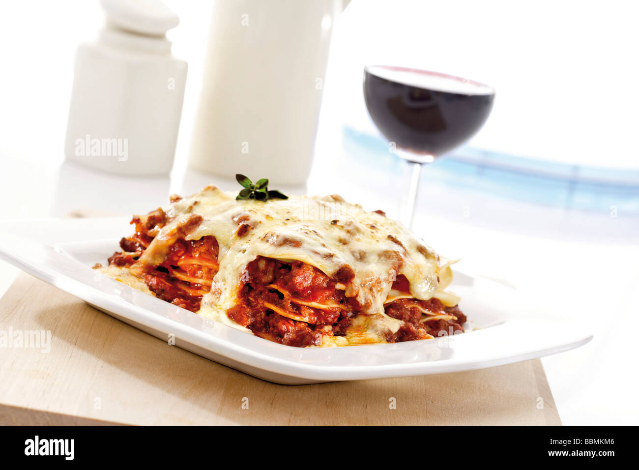 Lasagna with red wine Stock Photo Alamy
