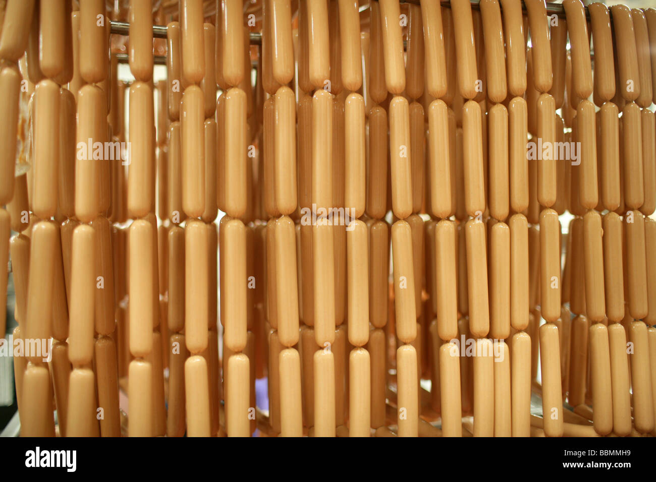 Rows of hotdogs in a Hotdog manufacturing plant Stock Photo
